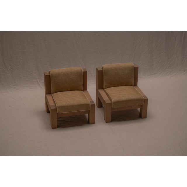 A striking pair of Brutalist easy chairs crafted from solid oak — strong, architectural pieces that exhibit a confident...