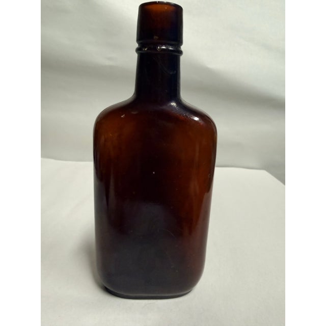 Transitional Antique j.c.s. Magnus & Co. Amber Glass Whiskey Bottle Flask For Sale - Image 3 of 10