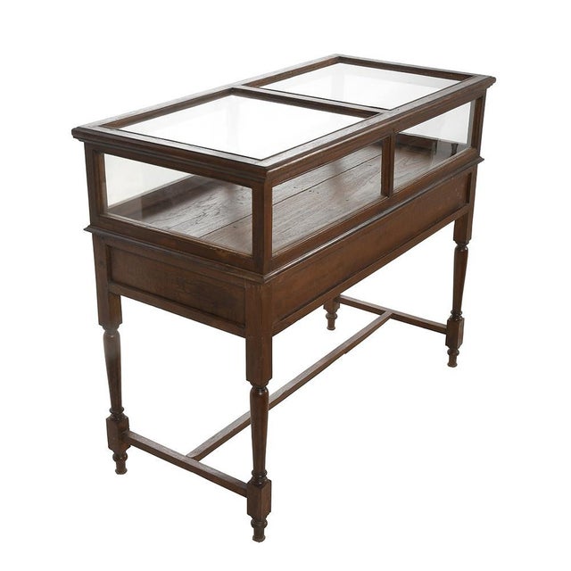 Wooden presentation showcase (old teak) from the 1940s. This piece is designed in the style of the selected designer...