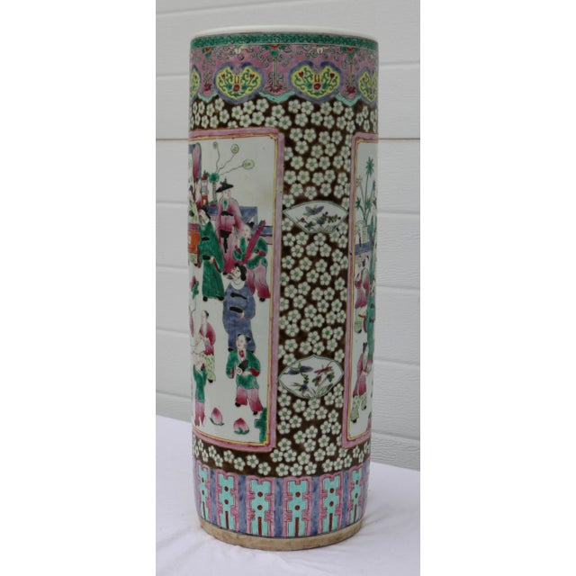 This is a beautiful, large Chinese famille pattern umbrella stand. I love the story it tells of everyday life. An amazing...