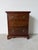 Elegant Early 20th Century Chippendale-style bachelor’s chest or small nightstand, crafted from solid mahogany with a rich...