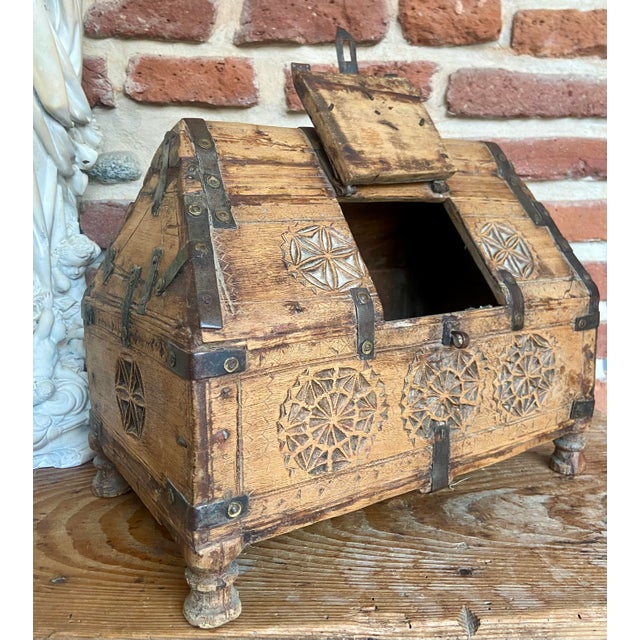 A beautifully hand-carved early 19th century Indian dowry chest, made in solid wood with original iron strapwork and...