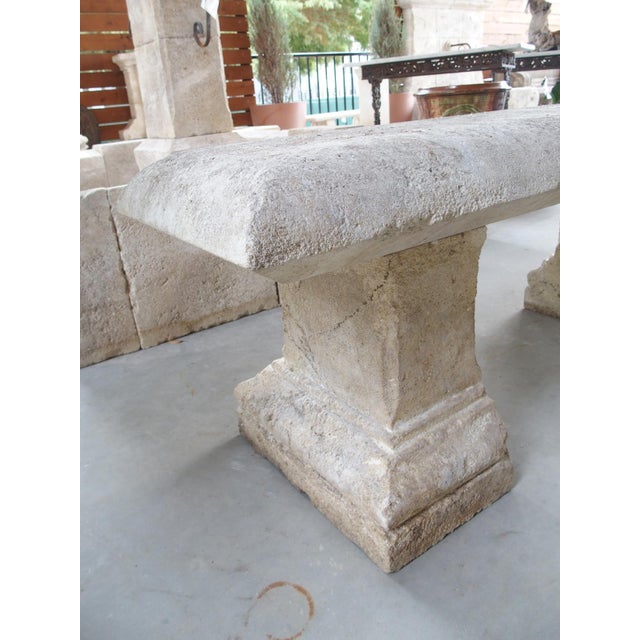 This charming limestone garden bench features a five-inch-thick seat capable of seating two adults comfortably. Hand-...