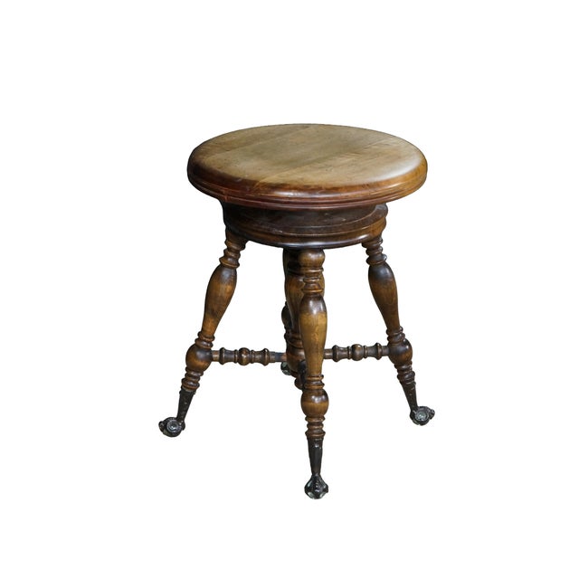 Antique Victorian piano stool or seat. Made of birch featuring round form with and turned columns capped with glass ball...