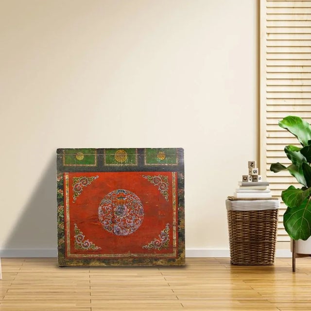 The front of this antique cabinet is decorated with hand painted flower wreath in the center and decorative flowers and...
