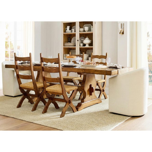 A striking set of four vintage Scandinavian Brutalist dining chairs, crafted in solid wood and dating to the mid century...