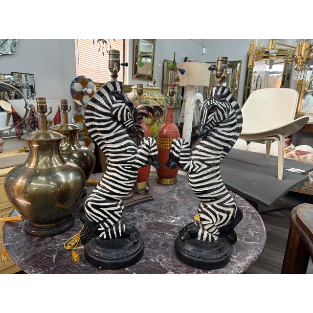 Pair Of Hollywood Regency Plaster Zebra Mirrors. Offered is a large pair of Hollywood Regency style plaster lamps in the...