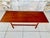 Mid-century, vintage, teak coffee table circa 1960's Table is made of teak. Top has a lighter finish while legs are...