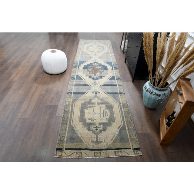 Vintage Hand-Knotted runner rug is a semi-antique vintage runner rug. The '70s Eastern region of Anatolian's unique rug is...