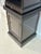 A striking ebonized obelisk-form étagère by Baker Furniture from the Stately Homes Collection, inspired by classical...