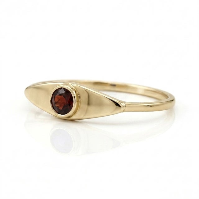 Make a sophisticated, fiery statement with this classic talisman-inspired ring. Featuring a rich, deep-red 3mm Garnet...