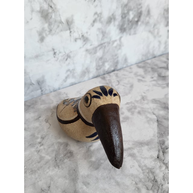 This is a beautiful vintage Tonola Mexico bird. It is a folk art accent piece and has glazed flowers.