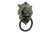 A solid green brass lion's head door knocker with intricately cast details throughout. We have more door knockers...
