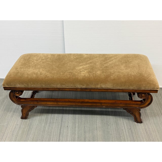 Design Plus Gallery presents a Vintage Bench from Bernhardt. The piece has a plush, golden velvet upholstered cushion seat...