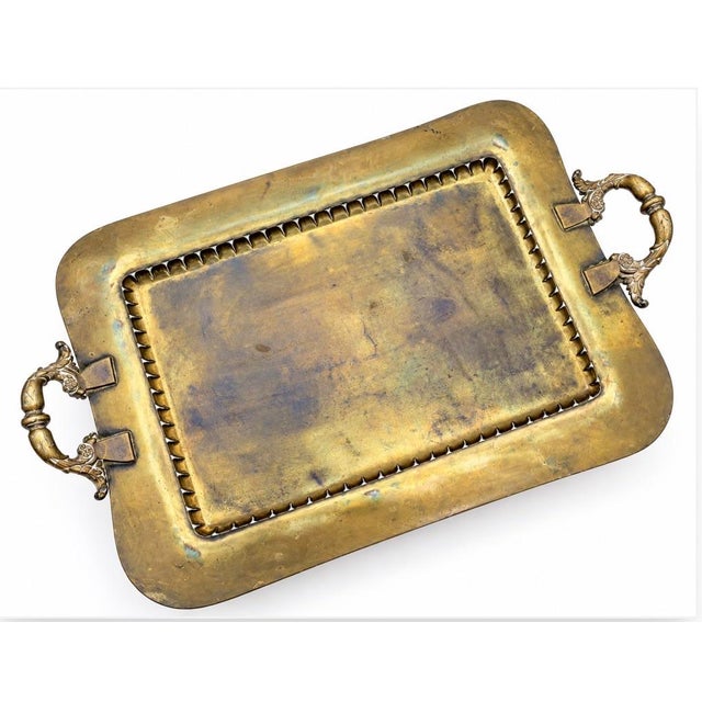 Extremely hefty brass tray, pictured is the backside which is unmarked but showing hefty weld and construction. Ornate...