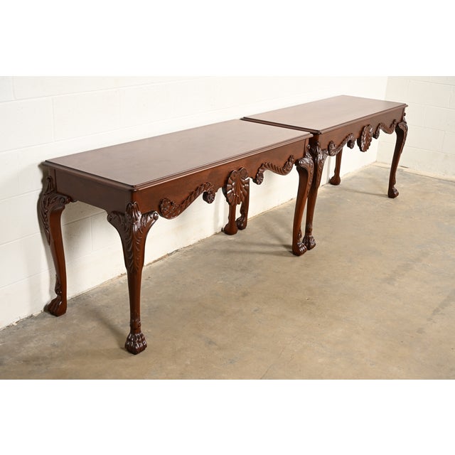 An exceptional pair of Georgian or Chippendale style console tables or sofa tables By Baker Furniture USA, Circa 1980s...