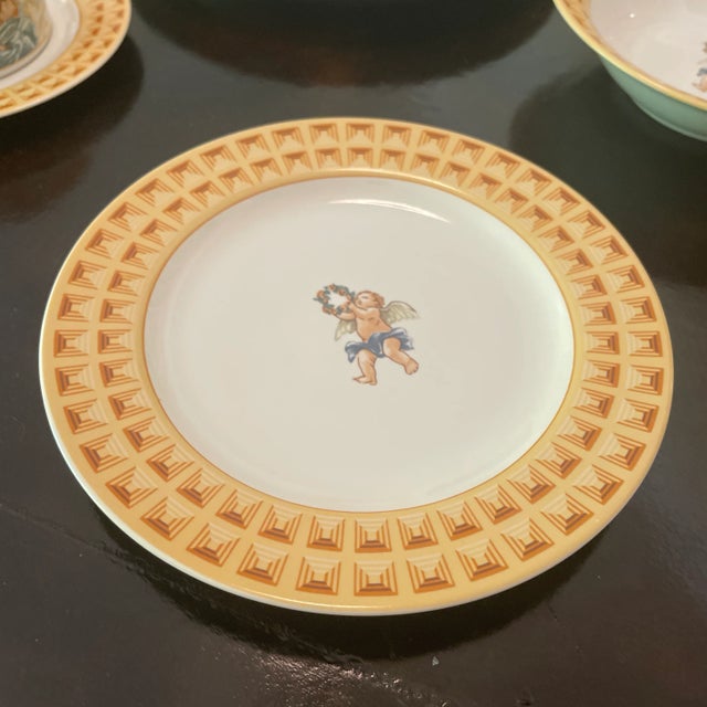 Retired & Rare Five Piece Place Setting In The HABITAT AMERICANA CHERUBS PATTERN BY OMNIBUS/FITZ AND FLOYD. THIS 5 Piece...