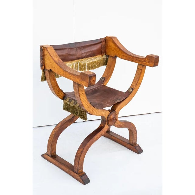 Savonarola chair, Made in Italy, Year 1900. The frame is made of solid wood. The seat and back are ORIGINAL leather,...