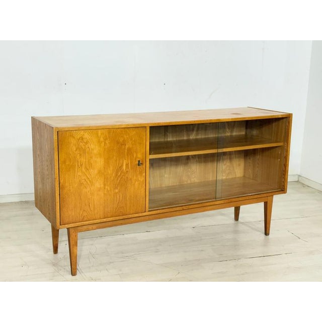 Very beautiful vintage sideboard from the Hellerau 602 series in good condition. with its gorgeous ash wood grain, it...