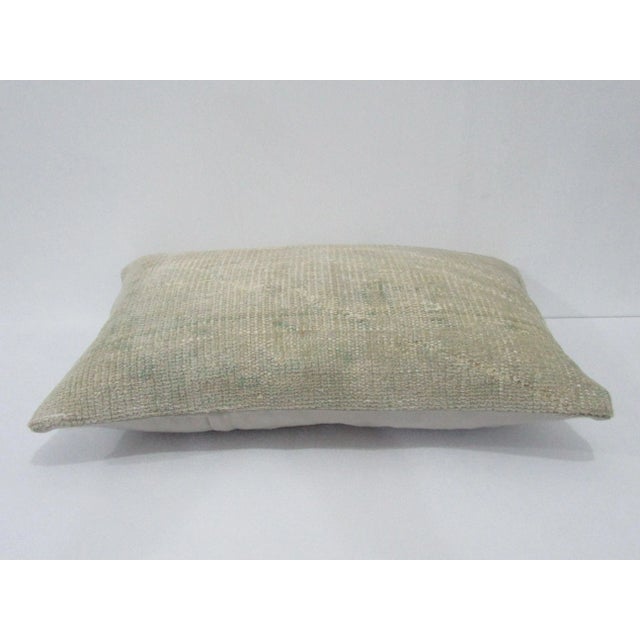 Decorative pillow cover made from a vintage Turkish handknotted rug. Backed with good quality cotton fabric. Pillow...