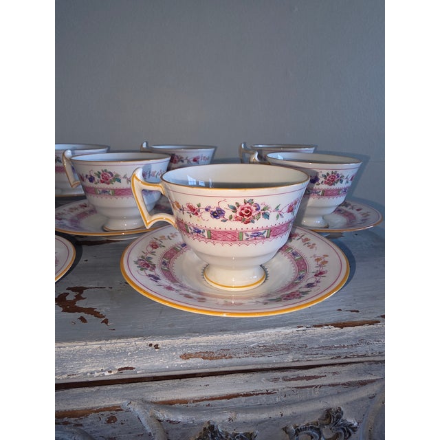 Traditional English Antique Footed Cups and Saucers by Royal Doulton Pattern number E4630. Ten cups and ten saucers.