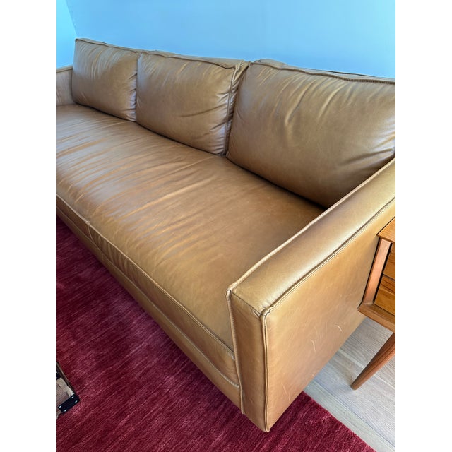 West Elm genuine leather couch, brown color, 89x34.5x32 inches, 8 inches from the floor. No rips, but some fading on the...