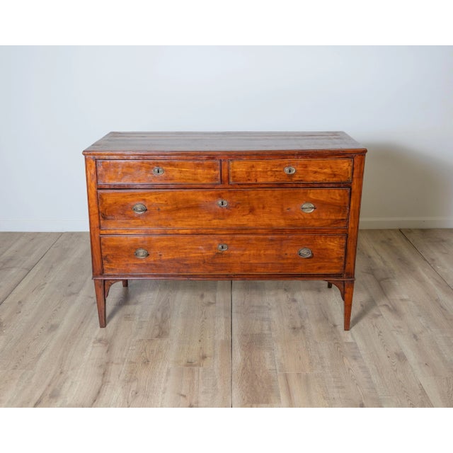 A beautiful 18th-century Italian chest of drawers from Venice, masterfully crafted in solid cherrywood and showcasing the...
