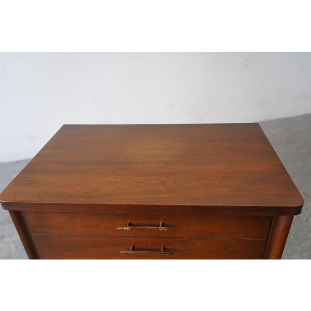 Beautiful pair of vintage Broyhill Saga nightstands featuring warm walnut tones, clean mid-century lines, sculpted legs,...