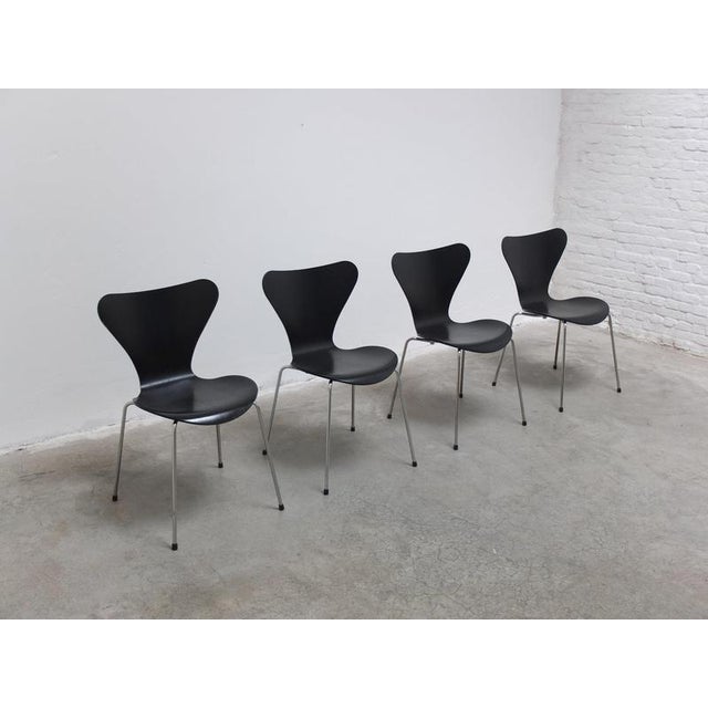 Set of 4 ‘Series 7’ dining chairs designed by Arne Jacobsen in 1955. These are black lacquered examples with a nice...