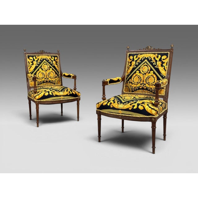 Gianni Versace Fabric Louis XVI Style, Armchairs, Walnut, France, 20th c. A refined pair of 20th century Louis XVI–style...