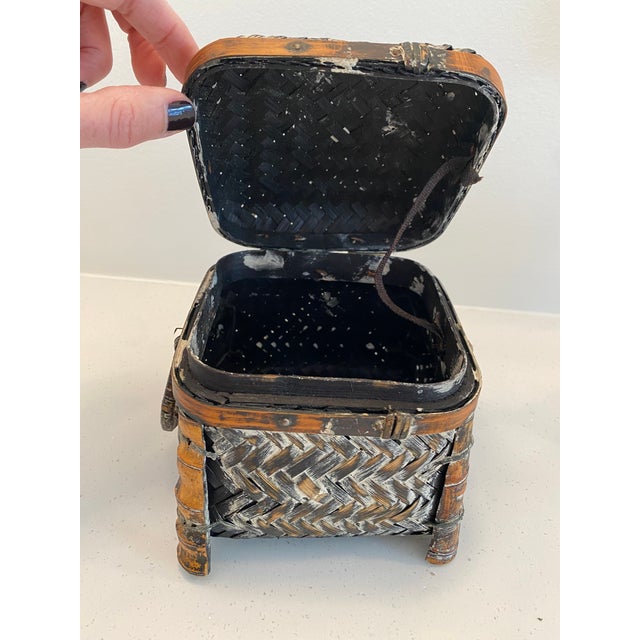 Small hinged woven rattan box basket.