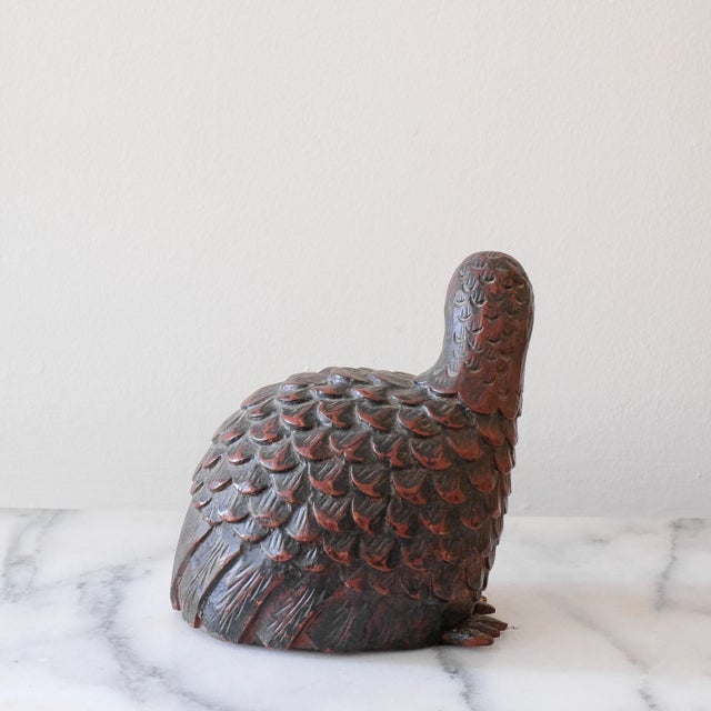 Antique carved Japanese quail, in good overall condition. There is some minimal wear on one of the feet (mostly the stain...