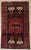 Antique hand-knotted rug from the Koliai Kurdish weaving region of western Iran, featuring a bold geometric composition...