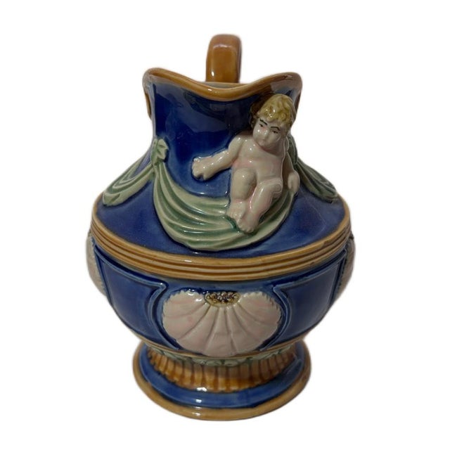 Vintage Cobalt Nouveau Majolica Art Pottery Putti & Seashell Coastal Pitcher Channel an old-world European romance with...