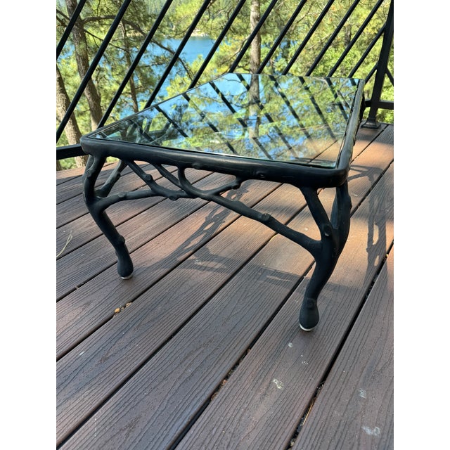 A vintage American indoor/outdoor loveseat with branching tree limb motif, like the ones seen in this summer's issue of...