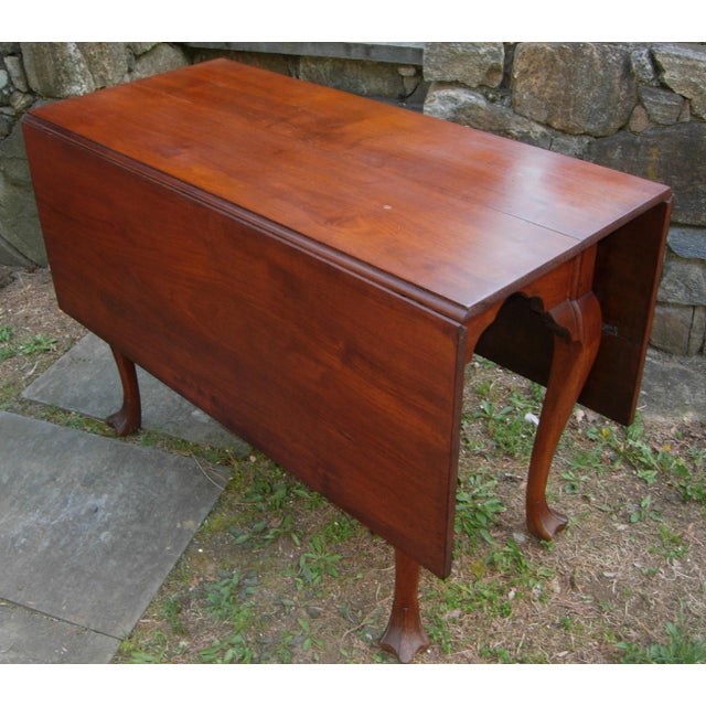 Lovely 18th century Pennsylvania Walnut Drop Leaf Table with carved Drake or Trifid feet. The table measures 39-3/4 inches...