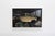 This oil on wood panel artwork captures a vintage car nestled within a cluttered garage, surrounded by tools and machinery...