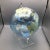 Featuring a screen printed light blue acrylic globe on a canted semi-circular clear acrylic rod form holder and wedge...
