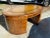 This is a Maitland-Smith Regency-style inlaid mahogany oval partners desk with a tooled leather writing surface. Burl wood...