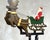 This rare vintage kinetic balance sculpture depicts Santa Claus seated in a sleigh pulled by reindeer, designed as a...