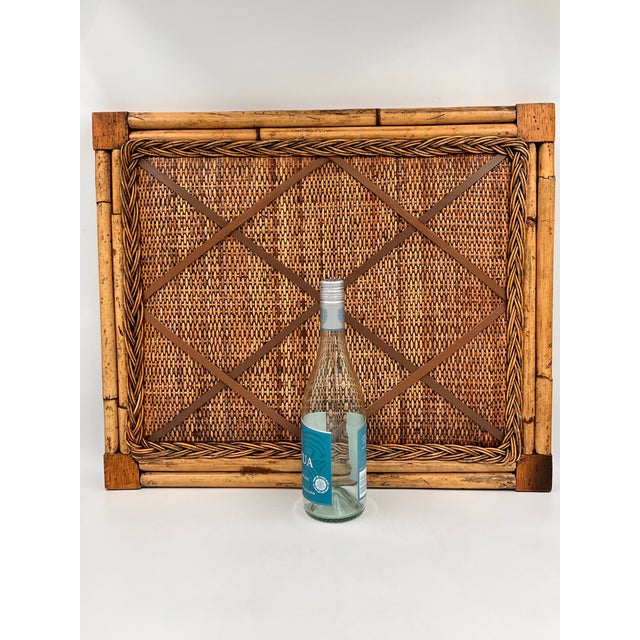 Exceptional, vintage bamboo and rattan bulletin board, featuring an intricately woven natural fiber surface, surrounded by...