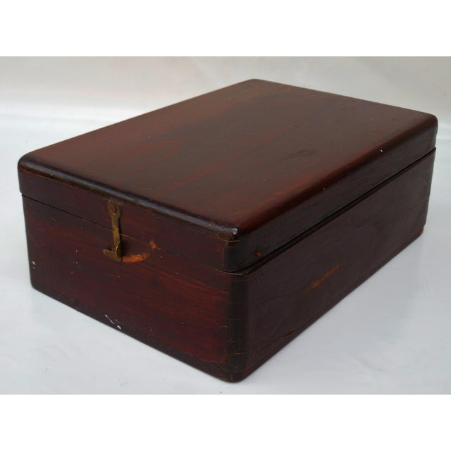 A handsome 19th-century gentleman’s grooming box crafted from walnut. This portable "campaign" style kit features a deep...