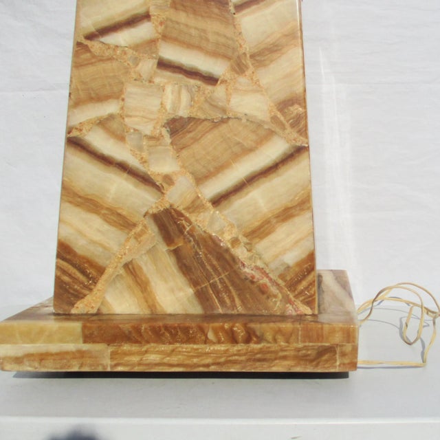 Onyx slab constructed pylon style pedestal with an interior light. Built with a brown and tan onyx stone and reinforced...
