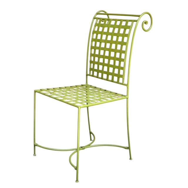 A set of four delightful garden chairs; France, 1960s. Finished in a vibrant spring green, each chair is comprised of a...