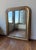 A 19th Century French Louis Philippe mirror with a gilded wooden frame, featuring the period’s characteristic rounded...