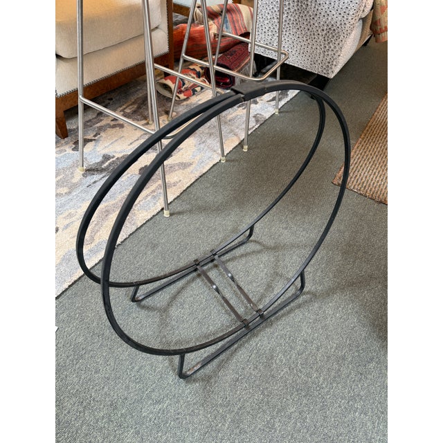Design Plus Gallery presents a Firewood Holder in the Hoop Style. The holder is made of welded wrought item that has a...