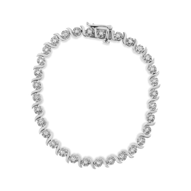 Feminine yet glamorous, this bracelet shines in a polished setting in real, solid .925 sterling silver. The tennis...