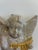 A charming vintage chalkware wall plaque depicting a cherub angel playing a harp. Hand-painted in soft pastel tones and...