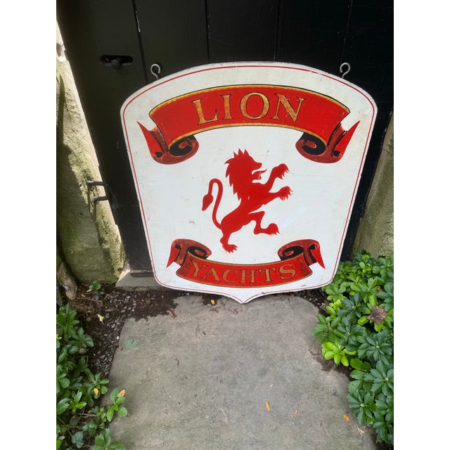 A fabulous vintage trade sign advertising Lion Yachts. Hand painted on both sides, the sign is constructed of wood with...