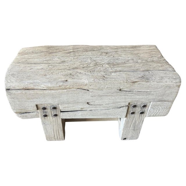 Beautiful aged teak wood bench with a nine inch thick top and original hardware. We added a ceruse finish to reveal the...